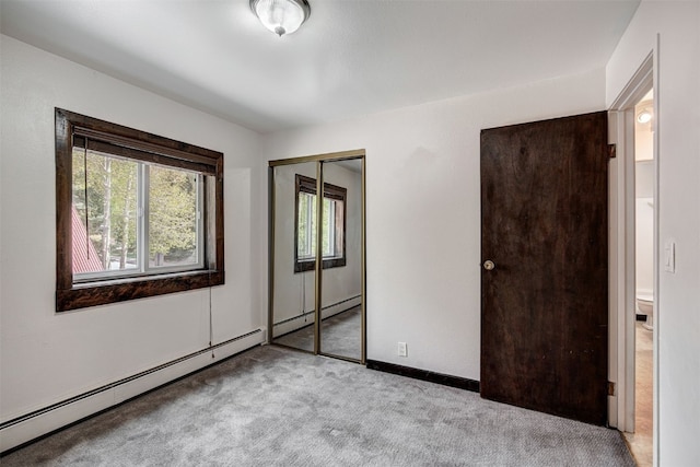214 S Harris St Unit 206, Breckenridge, CO 80424 - unfurnished bedroom featuring carpet, baseboard heating, a closet, and baseboards
