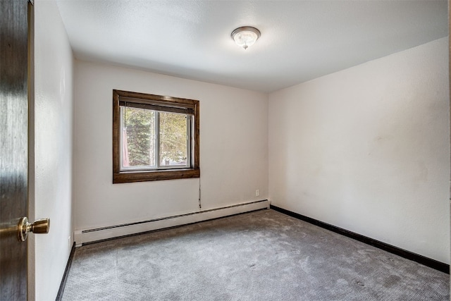 214 S Harris St Unit 206, Breckenridge, CO 80424 - spare room featuring a baseboard radiator, carpet, and baseboards