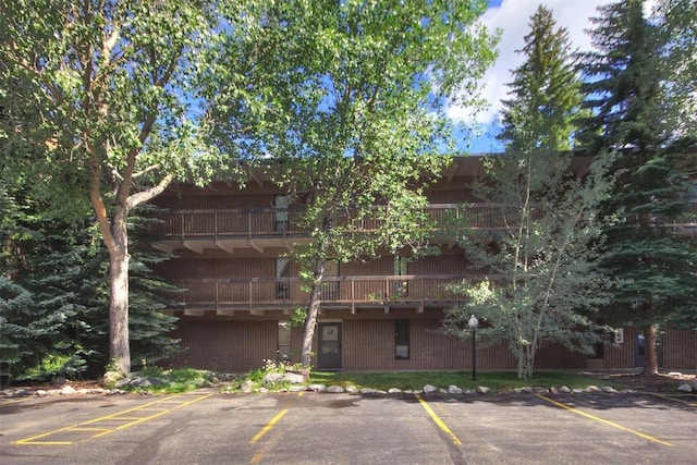 view of property with uncovered parking
