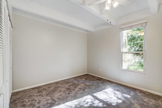 carpeted spare room with baseboards, beamed ceiling, and ceiling fan
