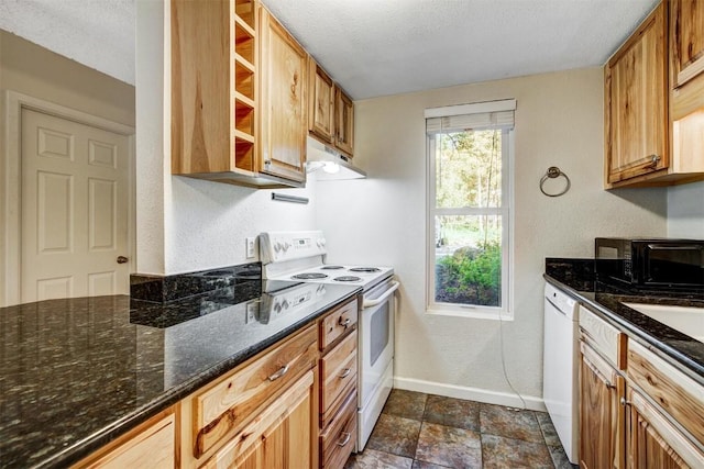 kitchen with white appliances, open shelves, baseboards, a textured wall, and under cabinet range hood