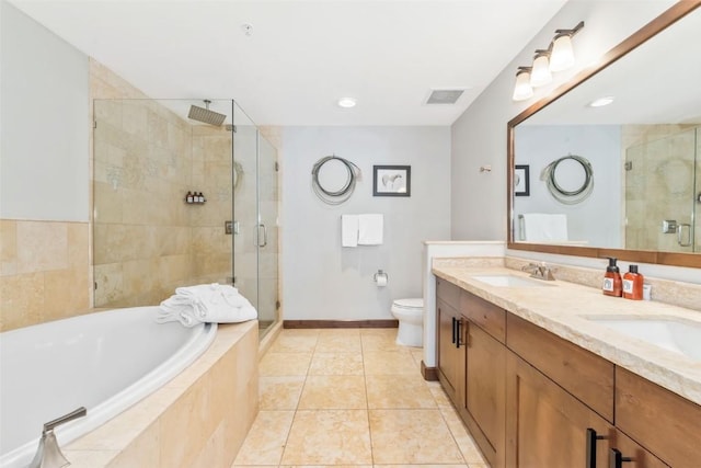 full bath with a bath, a sink, double vanity, and a stall shower