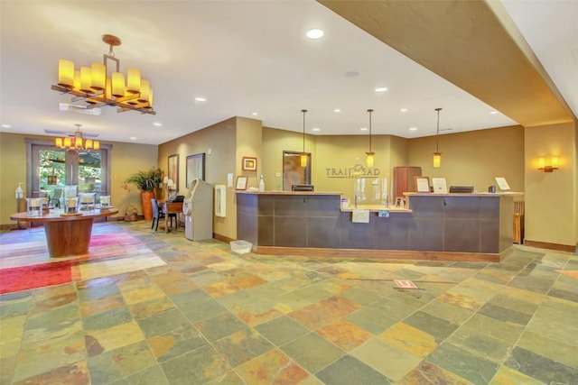 welcome area featuring a notable chandelier