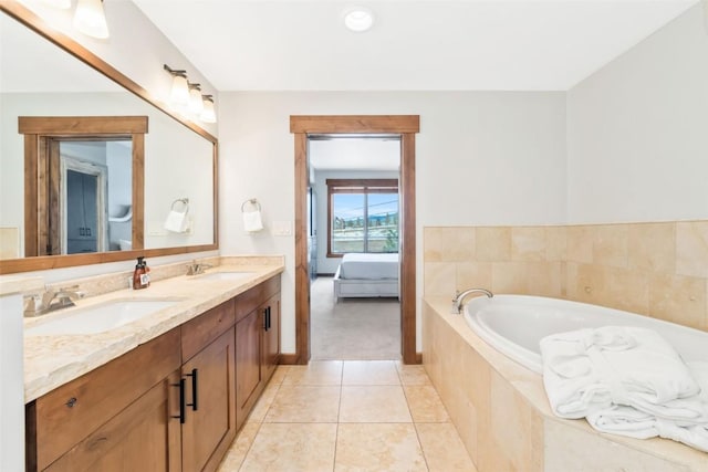 bathroom with tile patterned flooring, a bath, a sink, and double vanity