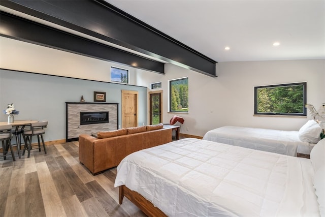 89 Wilderness Dr, Breckenridge, CO 80424 - bedroom with recessed lighting, wood finished floors, and a tiled fireplace