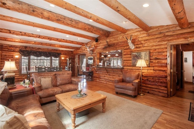 192 Johnson Rd, Silverthorne, CO 80498 - living area featuring recessed lighting, beam ceiling, wood finished floors, and log walls