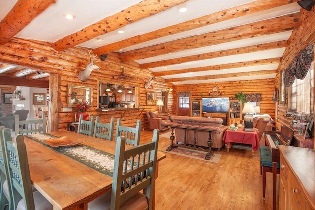 192 Johnson Rd, Silverthorne, CO 80498 - dining room with log walls, wood finished floors, beam ceiling, healthy amount of natural light, and recessed lighting