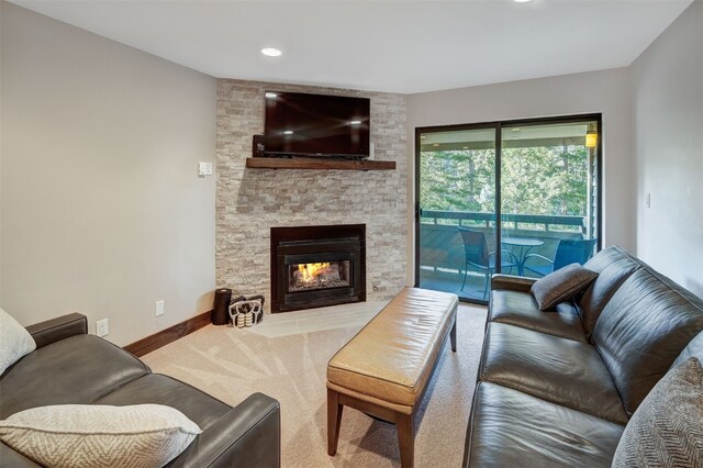 1001 Grandview Dr Unit 22, Breckenridge, CO 80424 - living room with a stone fireplace, carpet floors, baseboards, and recessed lighting