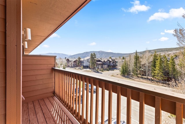 balcony featuring a mountain view and a residential view