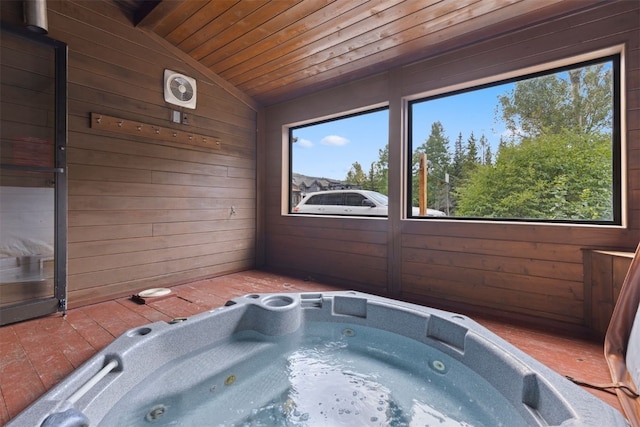 bathroom featuring lofted ceiling, wood ceiling, and wood walls