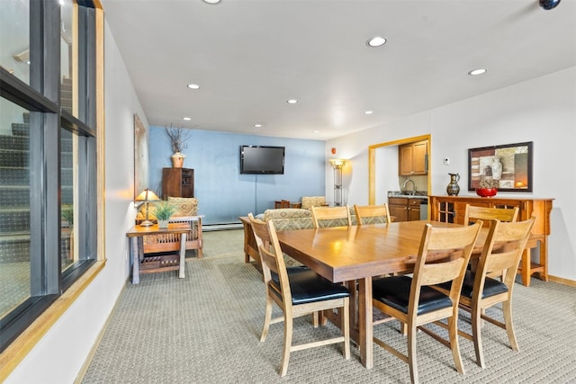 dining room featuring light colored carpet, recessed lighting, a baseboard heating unit, and baseboards