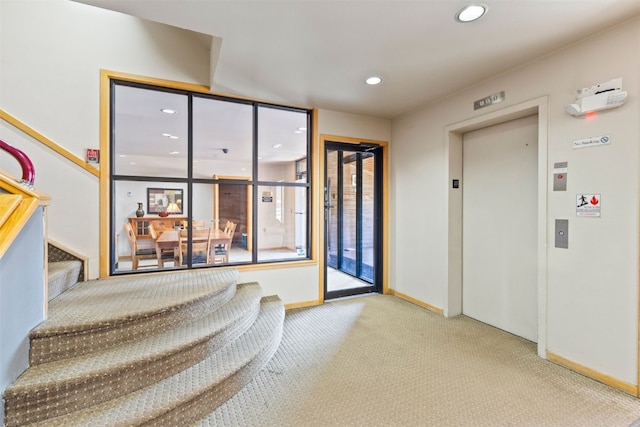 lobby with recessed lighting and stairway