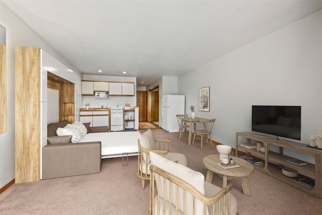 carpeted living room with recessed lighting