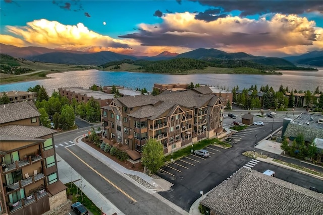 aerial view at dusk with a water and mountain view