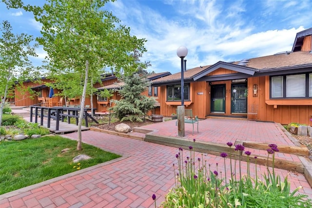 2615 Apres Ski Way Unit B1, Steamboat Springs, CO 80487 - back of house with a deck and board and batten siding