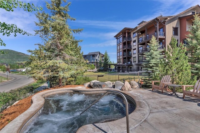 1175 Bangtail Way Unit 4107, Steamboat Springs, CO 80487 - view of pool featuring an outdoor hot tub and a mountain view