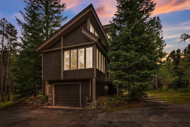 property exterior at dusk with a garage