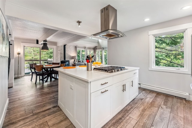 kitchen featuring white cabinetry, a baseboard radiator, beamed ceiling, island exhaust hood, and a kitchen island