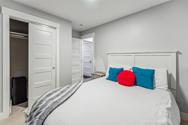 carpeted bedroom with a closet