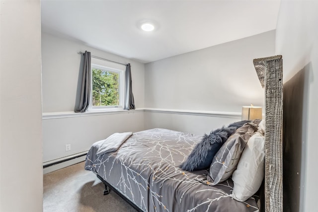 bedroom with carpet floors and baseboard heating