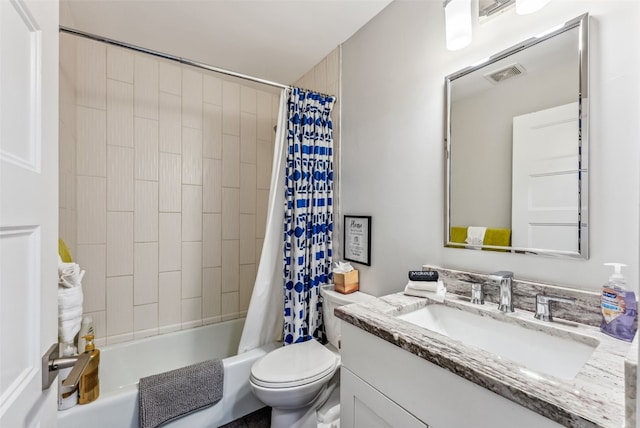 full bathroom with shower / bath combo with shower curtain, vanity, and toilet