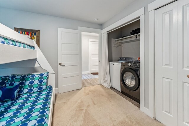 laundry area with light colored carpet