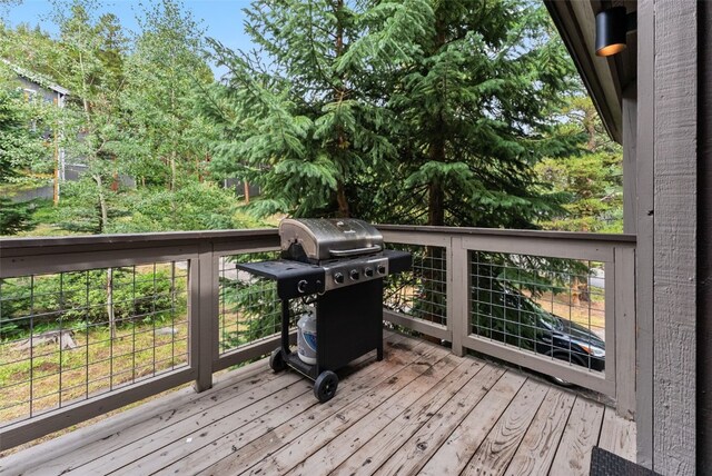 wooden terrace with grilling area