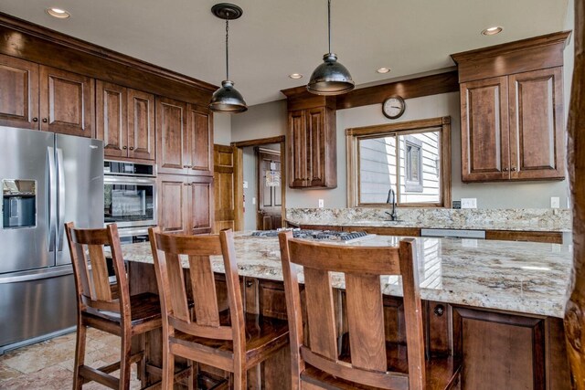 185 S Fuller Placer Rd, Breckenridge, CO 80424 - kitchen with appliances with stainless steel finishes, recessed lighting, light stone countertops, hanging light fixtures, and a sink