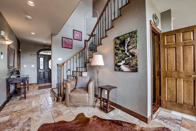 185 S Fuller Placer Rd, Breckenridge, CO 80424 - foyer entrance with stairs, baseboards, stone tile floors, and recessed lighting