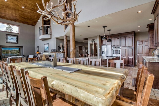 185 S Fuller Placer Rd, Breckenridge, CO 80424 - dining space with stone tile floors, high vaulted ceiling, and recessed lighting