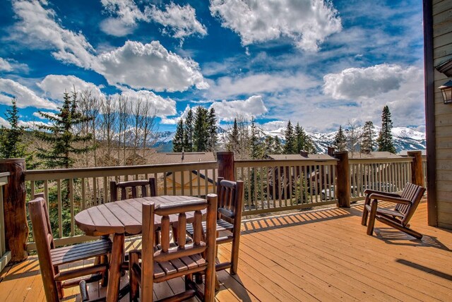 185 S Fuller Placer Rd, Breckenridge, CO 80424 - wooden deck with a mountain view and outdoor dining space