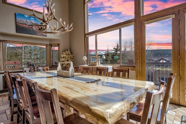 185 S Fuller Placer Rd, Breckenridge, CO 80424 - dining space featuring a chandelier and a towering ceiling
