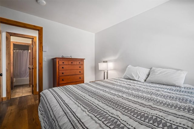 bedroom with dark wood finished floors