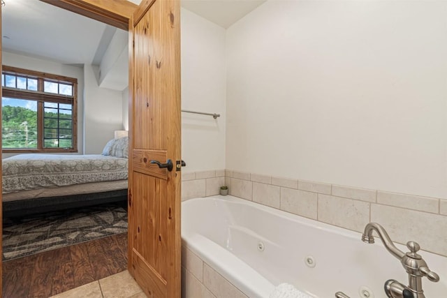 1110 Yampa St Unit R8, Steamboat Springs, CO 80487 - ensuite bathroom with a tub with jets and tile patterned floors