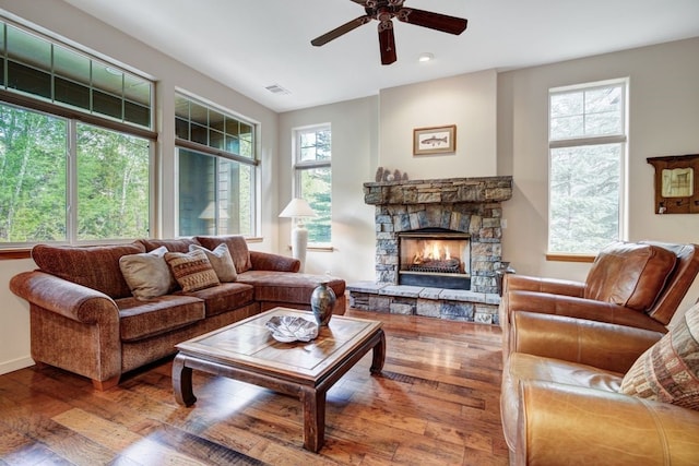180 Robin Dr Unit 180, Silverthorne, CO 80498 - living room with a ceiling fan, a stone fireplace, wood finished floors, baseboards, and recessed lighting