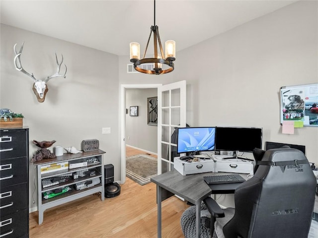 1527 Biffle Ct, Berthoud, CO 80513 - office with a chandelier and light wood-type flooring