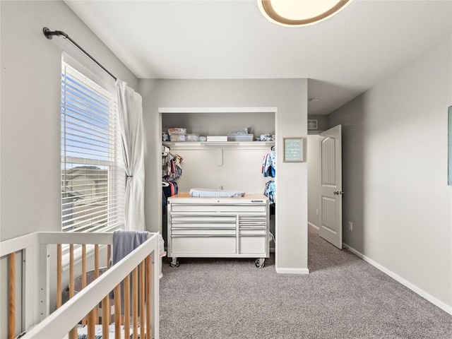 1527 Biffle Ct, Berthoud, CO 80513 - bedroom with carpet flooring, a closet, a crib, and baseboards