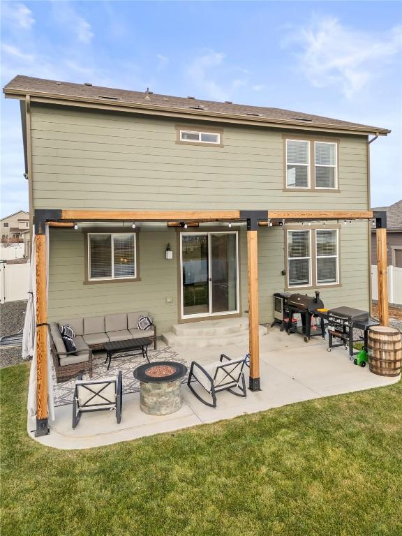 1527 Biffle Ct, Berthoud, CO 80513 - back of property featuring an outdoor fire pit and a patio area