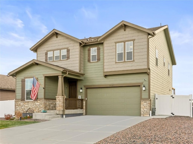 1527 Biffle Ct, Berthoud, CO 80513 - craftsman inspired home with stone siding, a gate, an attached garage, concrete driveway, and a porch