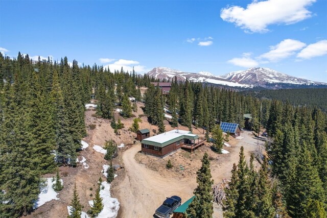 491 Valley Of The Sun Dr, Fairplay, CO 80440 - aerial view of property and surrounding area featuring a mountain backdrop and a heavily wooded area