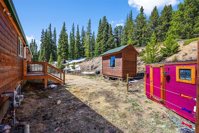 491 Valley Of The Sun Dr, Fairplay, CO 80440 - view of yard featuring a storage shed, an outbuilding, and stairway
