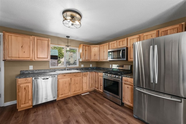 491 Valley Of The Sun Dr, Fairplay, CO 80440 - kitchen with appliances with stainless steel finishes, a sink, light brown cabinets, and dark countertops