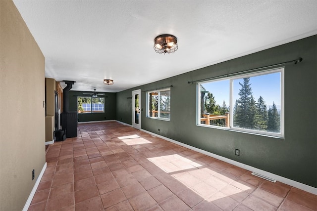 491 Valley Of The Sun Dr, Fairplay, CO 80440 - tiled spare room with baseboards and ceiling fan