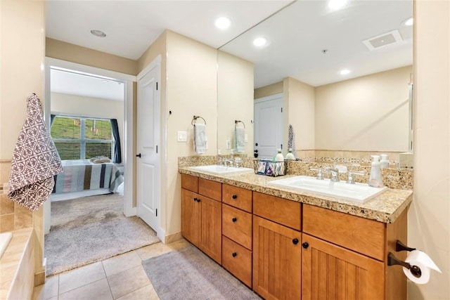 300 Base Camp Cir Unit 405, Granby, CO 80446 - ensuite bathroom featuring double vanity, tile patterned flooring, a relaxing tiled tub, and recessed lighting