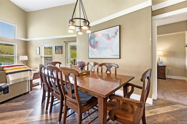 300 Base Camp Cir Unit 405, Granby, CO 80446 - dining room featuring wood finished floors, a chandelier, and a high ceiling