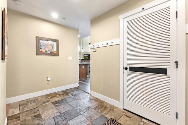 300 Base Camp Cir Unit 405, Granby, CO 80446 - hallway with baseboards and stone tile flooring