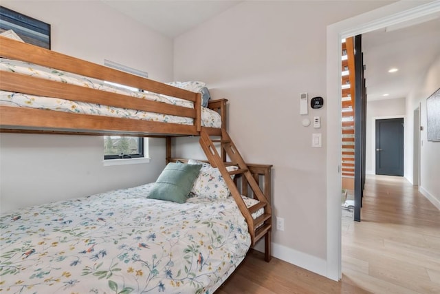 2894 Owl Hoot Trl, Steamboat Springs, CO 80487 - bedroom featuring wood finished floors, baseboards, and recessed lighting