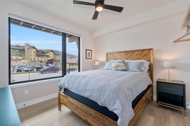 2894 Owl Hoot Trl, Steamboat Springs, CO 80487 - bedroom featuring wood finished floors, baseboards, and ceiling fan