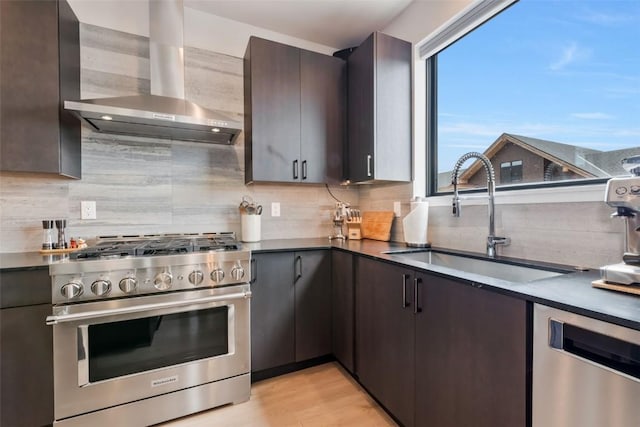 2894 Owl Hoot Trl, Steamboat Springs, CO 80487 - kitchen featuring stainless steel appliances, range hood, a sink, decorative backsplash, and dark brown cabinets
