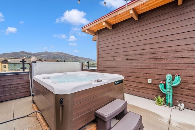 2894 Owl Hoot Trl, Steamboat Springs, CO 80487 - view of patio / terrace featuring a hot tub and a mountain view